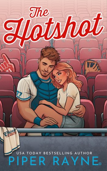 Book cover of The Hotshot by Piper Rayne, featuring an illustrated baseball player in catcher’s gear embracing a woman in stadium seating.